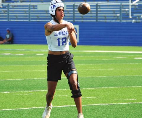 Dylan Sanchez flicks a pass into the flats during 7-on-7 action. HUNTER KING | DISPATCH RECORD