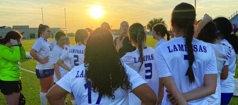 Head coach Emma Sharp talks to her team after their match against Marble Falls. COURTESY PHOTO
