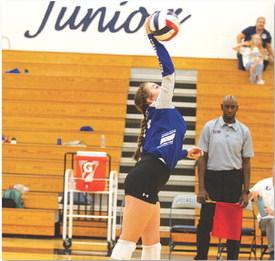Abbey Green hits a serve for the Lady Badgers. HUNTER KING | DISPATCH RECORD