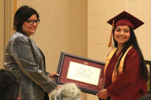Salutatorian Elizabeth Carbajal, at right, receives her award certificate from Lometa Principal Amanda Morris. MASON HINES | DISPATCH RECORD