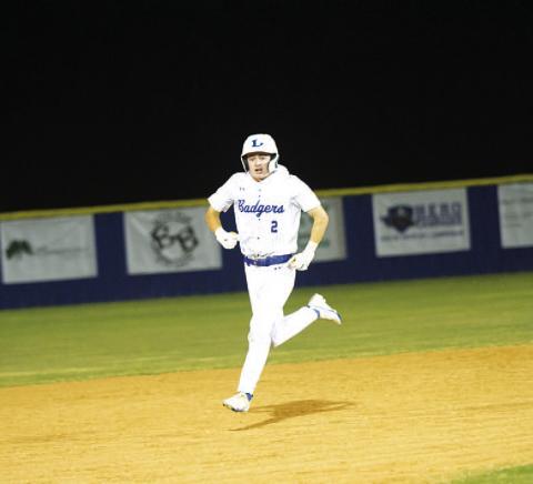 Cory White screams in celebration after rounding second base following his walk-off home run. HUNTER KING | DISPATCH RECORD
