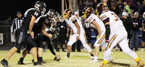 Adrian Smailus-Cruz, right, D.J. Smart and Elijah Gonzalez prepare to rush against Water Valley last Friday. JESSICA MALDONADO | DISPATCH RECORD