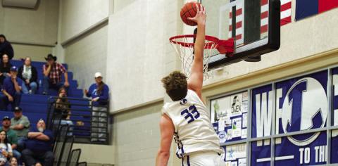 HUNTER KING | DISPATCH RECORD Beau Patterson throws down a dunk in Tuesday’s contest.
