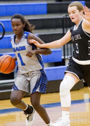Nattie Martin dribbles past a defender in Lampasas’ last game on Monday night in the Hill Country Hoops League. JEFF LOWE | DISPATCH RECORD