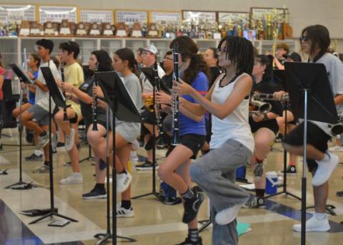 The Lampasas High School Badger Band practices some drill movments for its James Bondthemed show away from the heat on Tuesday afternoon. Erick Mitchell | dispatch record