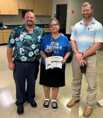Norma Rude was named Support Staff Member for August at the high school. She is presented her certificate by Lampasas High School Assistant Principal Ryan Race, at left, and Texas Farm Bureau’s Clay Phillips. Courtesy PHOTO