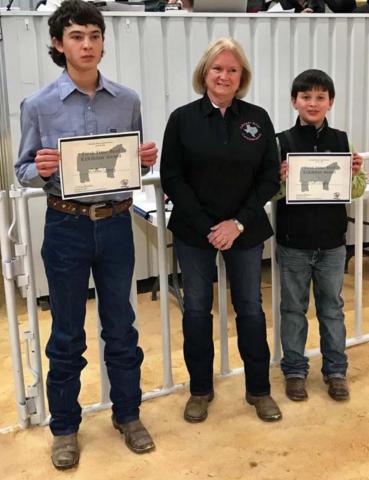 Lampasas County first-time beef exhibitors Dallas Gomez, at left, and Cort Maples are pictured with Janet Machen, Colorado River CattleWomen vice president. COURTESY PHOTO