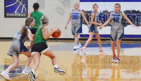 Addison Borchardt, left, plays on-ball defense while Kyliegh Ball, Payton Tatum and Cobie Chandler get ready down court in a recent game. JEFF LOWE | DISPATCH RECORD