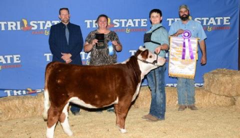Cort Maples poses for a photo with his miniature Hereford after being named Grand Champion Junior Showman at the Tri State Fair in Amarillo. Courtesy photo