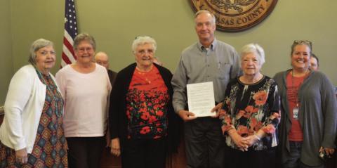 American Legion Auxiliary Unit 277 volunteers pose for a photo alongside County Judge Randy Hoyer after the court adopted a proclamation recognizing May 24 as National Poppy Day. Lampasas County residents are encouraged to wear a memorial poppy to honor America’s fallen heroes. ERICK MITCHELL | DISPATCH DISPATCH