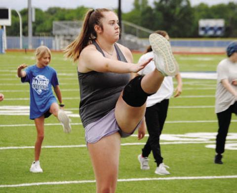 Abigail Williams warms up before a workout at last year’s SWAT. FILE PHOTO