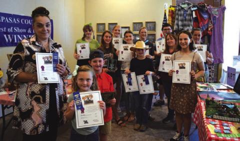 County Fair Best of Show winners in every age division and category pose for a photo during Spring Ho Festival week. ALEXANDRIA RANDOLPH | LAMPASAS DISPATCH RECORD
