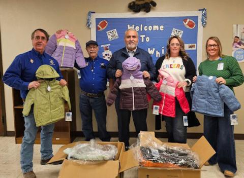 Delivering coats to Kline Whitis Elementary were Knights of Columbus members, from left, Rey Medrano, Bacillio Zamanegio and Jess Ramos; shown with school counselor Mandy Warren and Assistant Principal Tracie Chapa, who assisted with the donation. jim tracy | courtesy photo