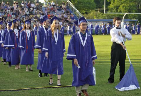 Lampasas High School graduates of 2024 march across Badger Field during a graduation ceremony last Friday to receive their diplomas and honors. ERICK MITCHELL | DISPATCH RECORD
