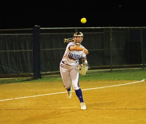 HUNTER KING | DISPATCH RECORD Kamryn Kothmann throws across the diamond from third base.