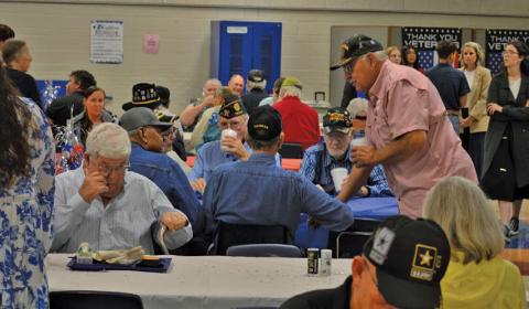 U.S. military veterans share conversations during breakfast served by Lampasas Middle School students before the campus’ 22nd annual Veterans Day ceremony. erick mitchell | dispatch record