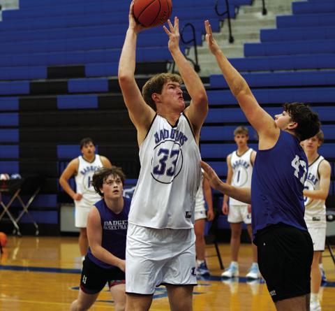Beau Patterson shoots over an outstretched defender during a recent practice. HUNTER KING | DISPATCH RECORD