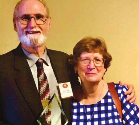 Steve Forsythe, shown with his wife, Cynthia, holds the Ag Education Hero Award he received from the Agriculture Teachers Association of Texas during the group’s annual summer convention. COURTESY PHOTO