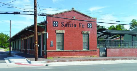 Austin businessman Rick Hardin had renovated the Santa Fe Depot and added several structures to the property in 2023. Now with new owners, the historic depot could see further development and become a railroad museum with a locomotive on display, a barbecue restaurant added and other features to make it a tourist destination. ERICK MITCHELL | DISPATCH RECORD