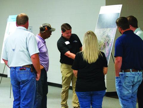 Representatives from Brazos Electric discuss plans for the Beecham Gap transmission line project with area residents at the Copperas Cove Civic and Conference Center on Aug. 6. HUNTER KING | DISPATCH RECORD