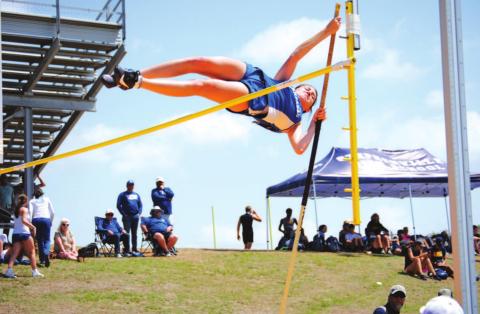 Peyton Tatum vaults over the bar in her first round and on her way to a fourth-place finish at the district meet. HUNTER KING | DISPATCH RECORD