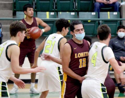 Luis Acevedo (12) sets a screen while Enrique Caso (back-left) looks for a teammate to pass to. JESSICA MALDONADO | LOMETA ISD