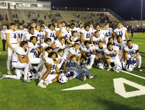 HUNTER KING | DISPATCH RECORD The Badgers pose with their bi-district trophy after last week’s win over Uvalde.