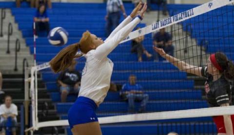 Juliana Dwamena goes up for a block against Lake Belton. HUNTER KING | DISPATCH RECORD