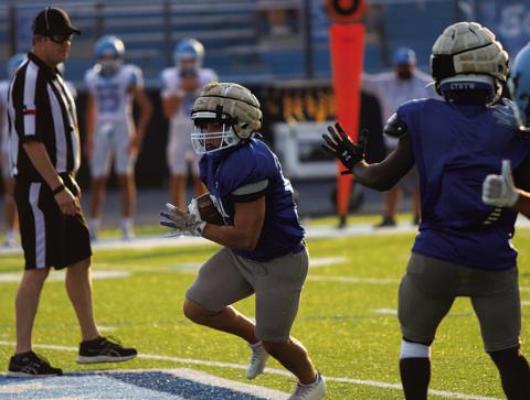 KJ Reed runs in the open field during the second scrimmage of the season last Thursday. HUNTER KING | DISPATCH RECORD