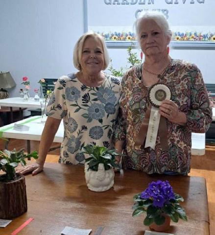 Teresa Stewart, at right, took home the Sweepstakes award for earning the most blue ribbons in the horticulture division of the L-M Garden and Civic Club Flower Show. Pictured with her is Sheri Stone, who served as the flower show judge. COURTESY PHOTO
