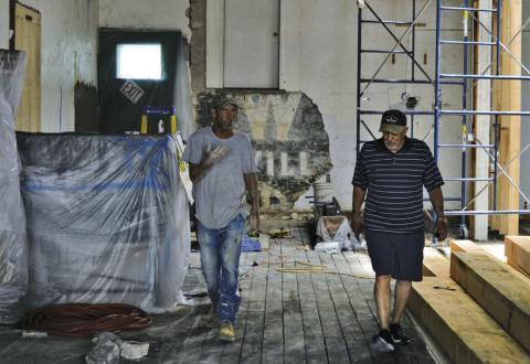 At left, Dwayne Friedlander of Holloman Masonry and Lampasas County Museum Foundation member Randy McGuire discuss repair efforts on the historic museum building. ERICK MITCHELL | DISPATCH RECORD