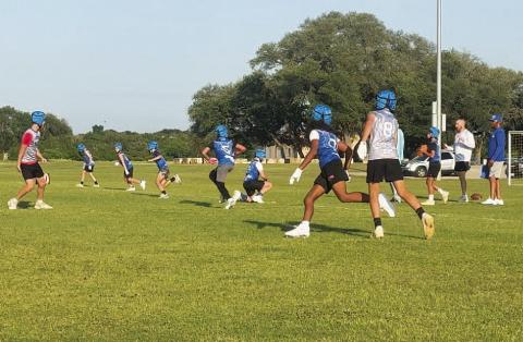 COURTESY PHOTO Fifth- and sixth-grade students run routes and play defense during 7-on-7 in May.