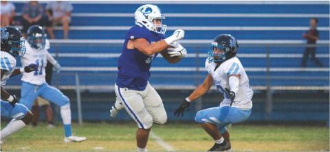 Raider Morua makes a defender miss on his way to the end zone last Friday. HUNTER KING | DISPATCH RECORD