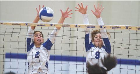 Landry White, left, and Lilee Hamill execute a block against Waco Connally. HUNTER KING | DISPATCH RECORD