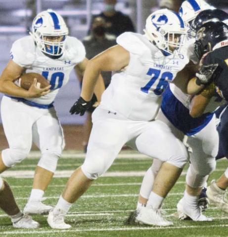 Caden Melton, right, blocks during the Badgers’ undefeated regular season in 2020. FILE PHOTO