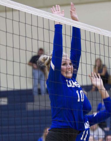Laurcy Bender reaches up for a block during the Lady Badgers’ match against the Jarrell Lady Cougars. Lampasas is set to play Burnet on the road Friday. HUNTER KING | DISPATCH RECORD