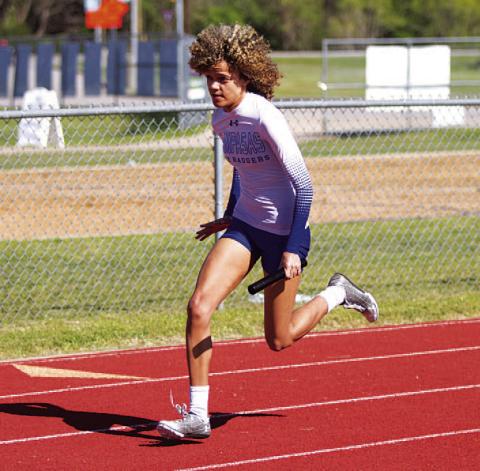 HUNTER KING | DISPATCH RECORD Aubrey Spellman competes in multiple relay races for the Lady Badgers.