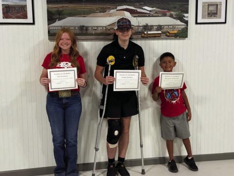 From left to right are Selie Hodge, James Horrell and Rolanzo Almaguer, who were recognized as students of the month at this week’s Lometa school board meeting. Kylie Pauly (not pictured) was named staff member of the month. COURTESY PHOTO