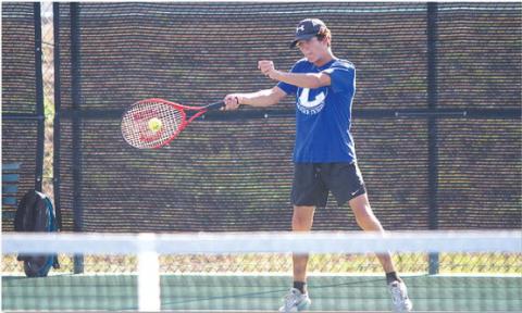 Brock Messinger swings through a forehand shot during Tuesday’s win over Glen Rose. The Badgers took every match. HUNTER KING | DISPATCH RECORD