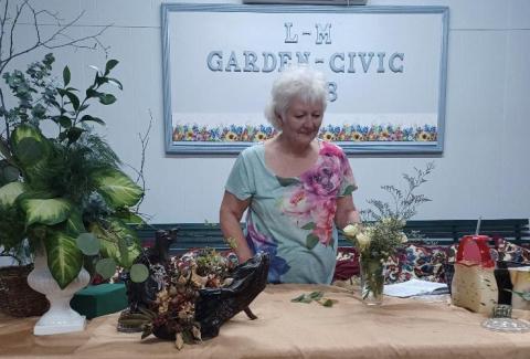 courtesy photo Donna McKinney brought sample flower arrangements to illustrate various design principles when she spoke to members of the L-M Garden &amp; Civic Club at the monthly meeting.