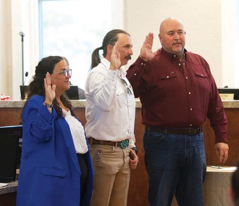 Council members Cathy Kuehne, Zac Morris (center) and Davis Keele took their oaths of office Monday night after votes from the May 2 municipal election were canvassed and accepted. hunter king | dispatch Record