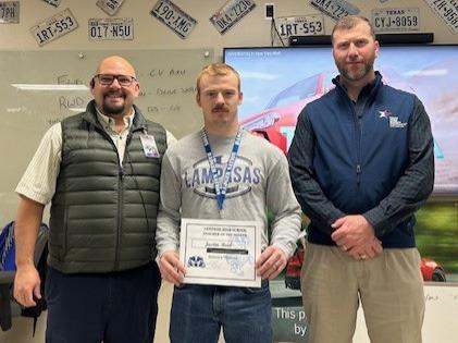 Justin Reid, center, was named a Staff of the Month honoree for January. A former Lampasas High School graduate, Reid now is an automotive program instructor. On hand to congratulate him are Assistant Principal Ryan Race, at left, and Clay Phillips of Texas Farm Bureau Insurance. courtesy photo
