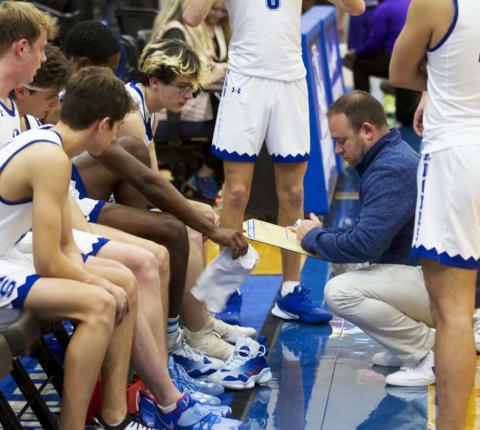 Lampasas head coach Aaron Nuckles is shown in this photo from a previous game drawing up a play for the Badgers. Although outside shooting was poor at Stephenville, the team was able to power past the Yellowjackets in the overtime period to solidify the first district win of 2022. FILE PHOTO