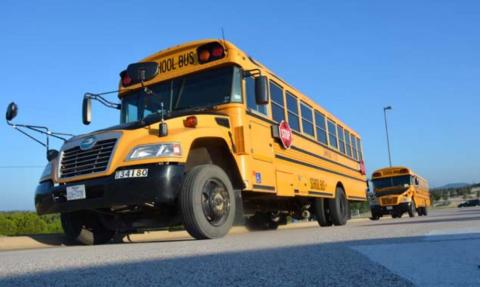 School buses line up outside Taylor Creek Elementary School on Thursday morning -- the first day of classes. MONIQUE BRAND | DISPATCH RECORD