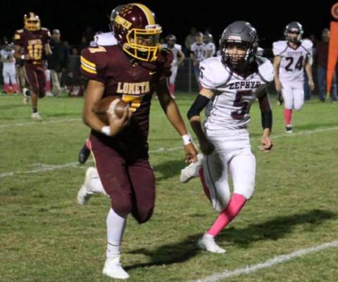 Leonel Caso runs away from a Zephyr defender during Lometa’s homecoming game earlier this year. MEGAN LUSTY| DISPATCH RECORD