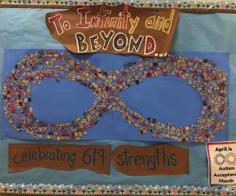 All 619 Taylor Creek Elementary School students played a part in this infinity symbol that recognizes April as Autism Awareness month. COURTESY PHOTO