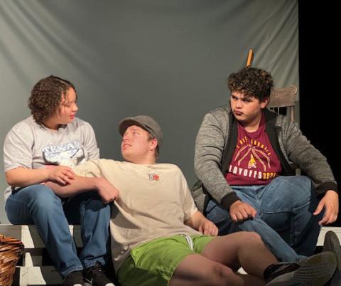 COURTESY PHOTOS Sholee Turner, Jacob Wooten and Lamar Linton, left to right, run lines during a practice on set. Lometa will compete in the district One-Act Play contest on Monday in Lometa.