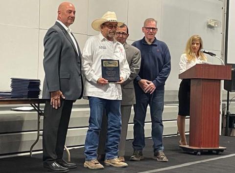 Adamsville Volunteer Fire Department Chief Dean Watson, holding plaque, was named First Responder of the Year for his entity by the Hill Country 100 Club. The club held its banquet March 7 to recognize area first responders. sharon watson | courtesy photo