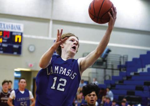 HUNTER KING | DISPATCH RECORD Peyton Sisson goes up to finish a layup during the scrimmages.