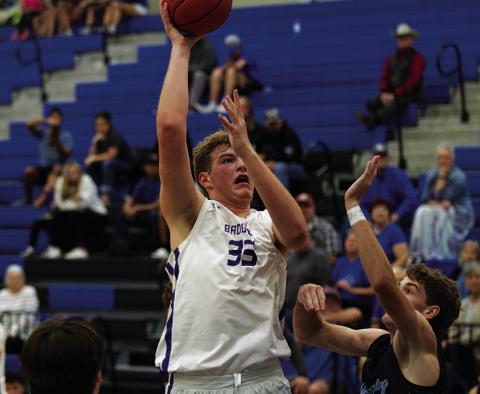 Beau Patterson goes up over a China Spring player for two of his 34 points last Saturday. HUNTER KING | DISPATCH RECORD